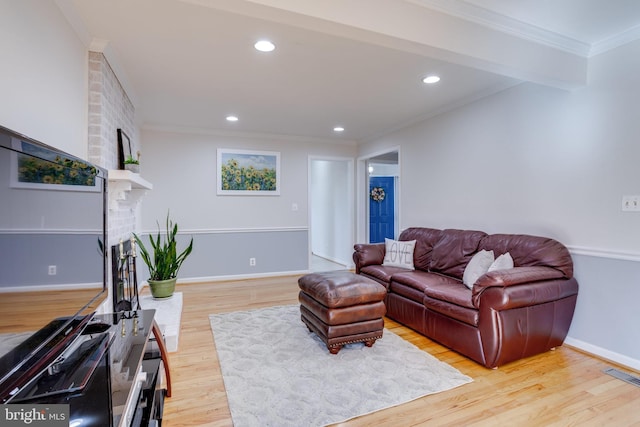 7530 Royce Ct, Annandale, VA 22003 - living room with a fireplace, light wood finished floors, ornamental molding, recessed lighting, and baseboards