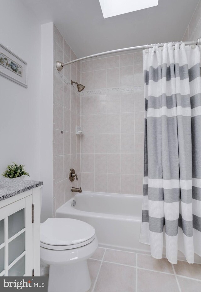 7530 Royce Ct, Annandale, VA 22003 - bathroom featuring tile patterned floors, shower / tub combo with curtain, toilet, and a skylight