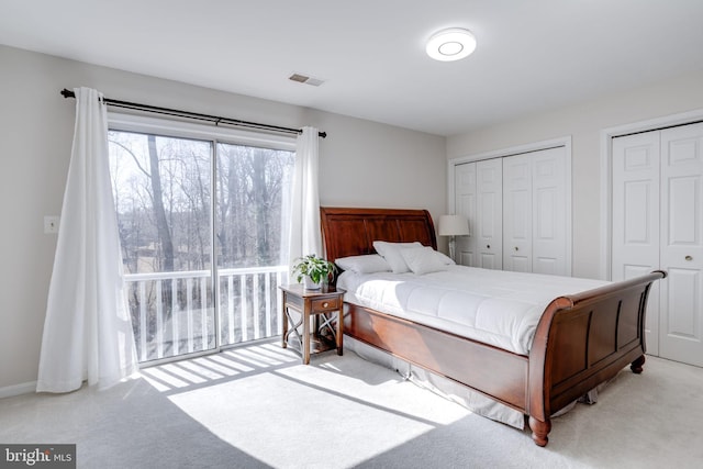 7530 Royce Ct, Annandale, VA 22003 - bedroom featuring light carpet, multiple closets, and access to exterior