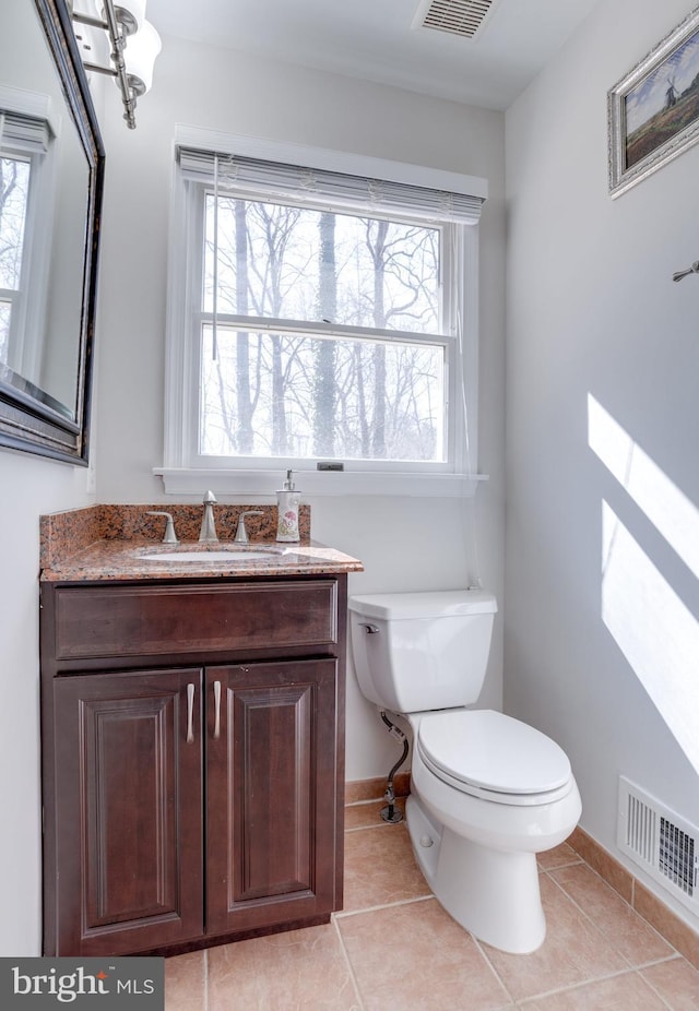 7530 Royce Ct, Annandale, VA 22003 - half bathroom with toilet, plenty of natural light, baseboards, and tile patterned floors