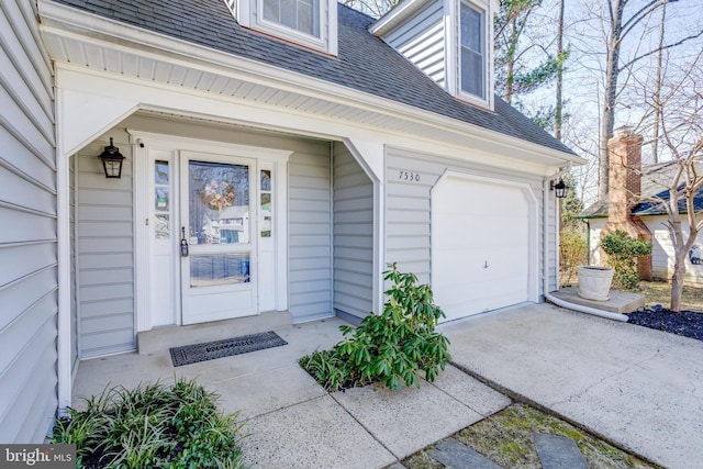 7530 Royce Ct, Annandale, VA 22003 - view of exterior entry featuring a shingled roof, driveway, and an attached garage