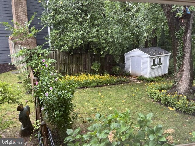 7530 Royce Ct, Annandale, VA 22003 - view of yard with a storage unit, fence, and an outdoor structure