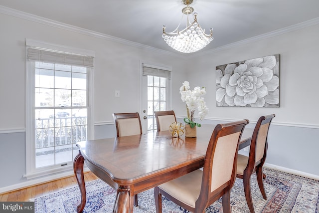 7530 Royce Ct, Annandale, VA 22003 - dining space featuring a chandelier, ornamental molding, light wood-style flooring, and baseboards