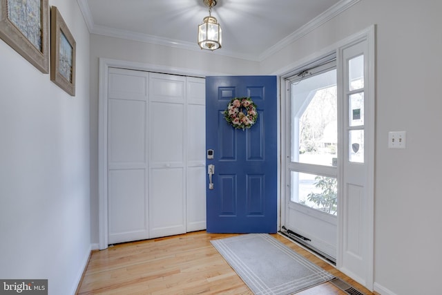 7530 Royce Ct, Annandale, VA 22003 - entrance foyer featuring light wood-type flooring, plenty of natural light, and crown molding