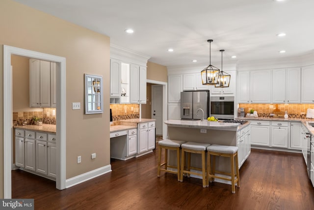 1002 Queen Annes Lace Way, Annapolis, MD 21401 - kitchen with stainless steel appliances, decorative backsplash, white cabinets, and recessed lighting