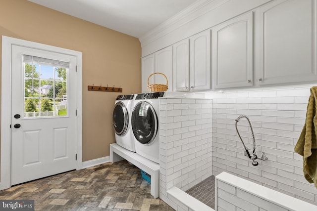 1002 Queen Annes Lace Way, Annapolis, MD 21401 - washroom featuring independent washer and dryer, cabinet space, brick floors, and baseboards