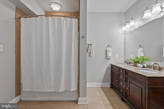1002 Queen Annes Lace Way, Annapolis, MD 21401 - full bathroom with tile patterned flooring, double vanity, shower / bath combo, and baseboards