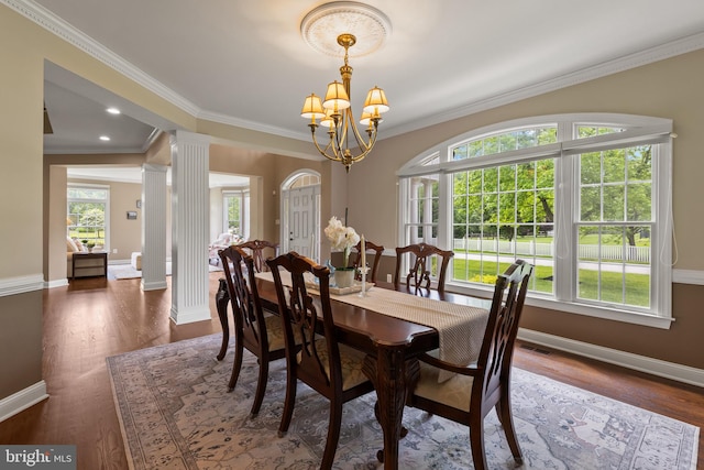 1002 Queen Annes Lace Way, Annapolis, MD 21401 - dining room with a chandelier, baseboards, healthy amount of natural light, decorative columns, and ornamental molding