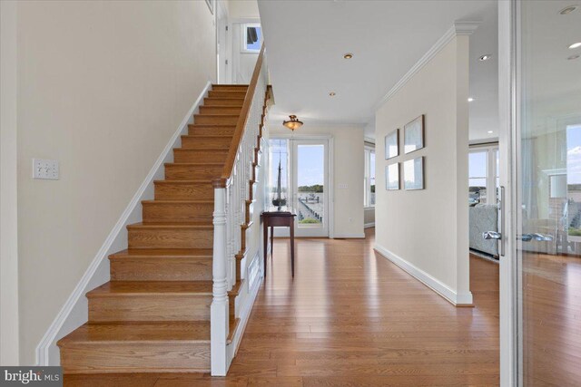 1100 Steamboat Rd, Shady Side, MD 20764 - stairway with ornamental molding, wood finished floors, baseboards, and recessed lighting