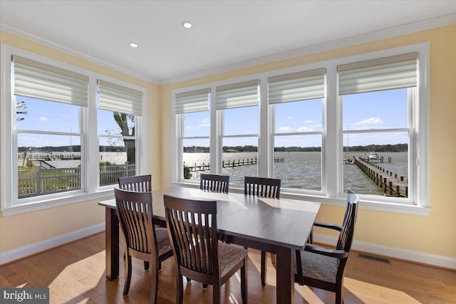 1100 Steamboat Rd, Shady Side, MD 20764 - dining space featuring baseboards, ornamental molding, wood finished floors, a water view, and recessed lighting