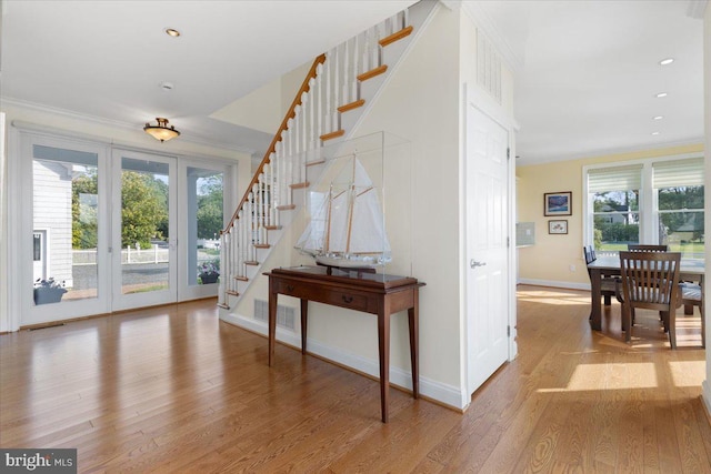 1100 Steamboat Rd, Shady Side, MD 20764 - entryway featuring crown molding, stairs, wood finished floors, baseboards, and recessed lighting