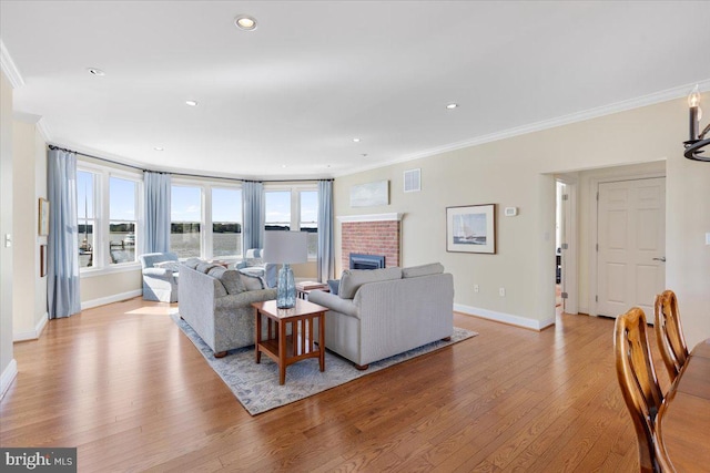 1100 Steamboat Rd, Shady Side, MD 20764 - living area with ornamental molding, wood finished floors, baseboards, healthy amount of natural light, and recessed lighting