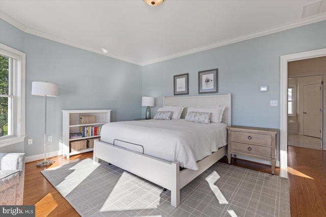 1100 Steamboat Rd, Shady Side, MD 20764 - bedroom with ornamental molding, wood finished floors, and baseboards