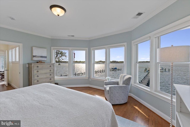 1100 Steamboat Rd, Shady Side, MD 20764 - bedroom featuring a water view, multiple windows, baseboards, and crown molding