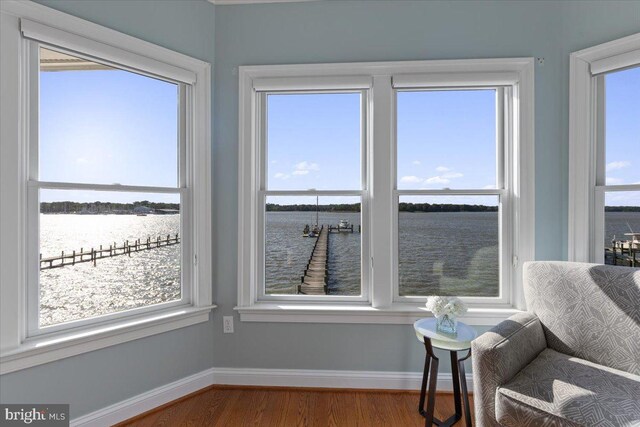 1100 Steamboat Rd, Shady Side, MD 20764 - sitting room with a water view, plenty of natural light, and wood finished floors