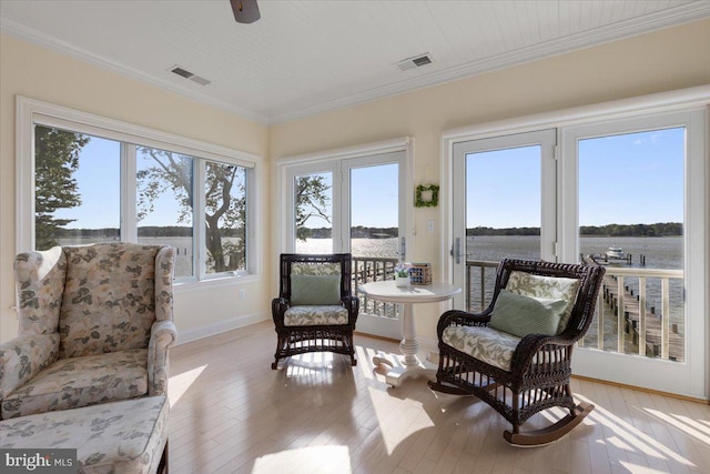 1100 Steamboat Rd, Shady Side, MD 20764 - sunroom with healthy amount of natural light, wood-type flooring, baseboards, and crown molding