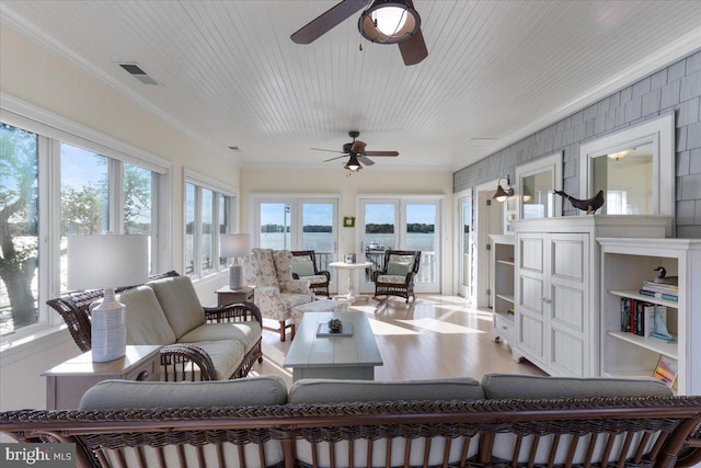 1100 Steamboat Rd, Shady Side, MD 20764 - sunroom / solarium with a water view, ornamental molding, wood finished floors, and french doors