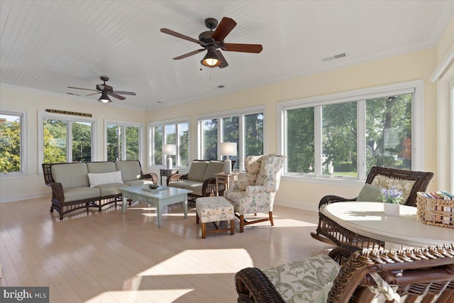 1100 Steamboat Rd, Shady Side, MD 20764 - sunroom with baseboards, wood-type flooring, and ornamental molding