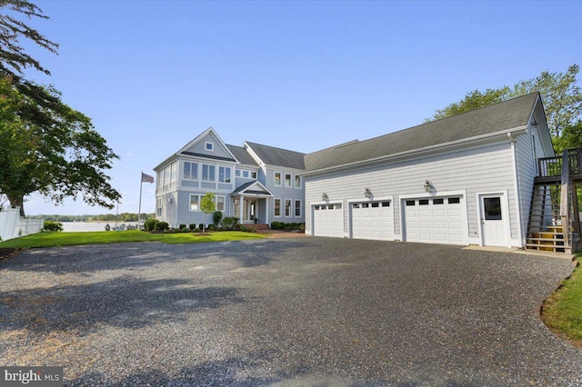 1100 Steamboat Rd, Shady Side, MD 20764 - view of front facade featuring stairs, asphalt driveway, and a garage