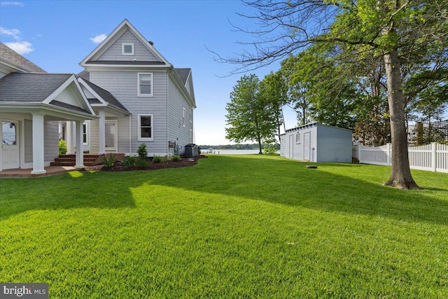 1100 Steamboat Rd, Shady Side, MD 20764 - back of house with an outdoor structure and central AC unit