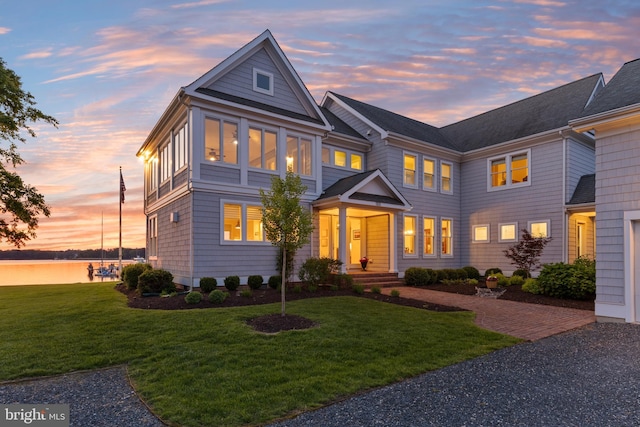 1100 Steamboat Rd, Shady Side, MD 20764 - view of front of house with a front lawn and a water view
