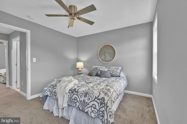 bedroom with carpet flooring, baseboards, and a ceiling fan