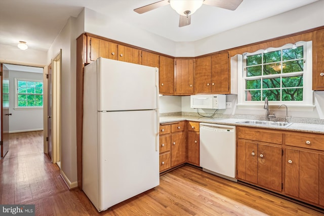 18312 Metz Dr, Germantown, MD 20874 - kitchen with white appliances, a sink, and brown cabinets
