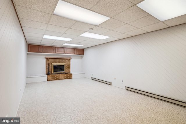 18312 Metz Dr, Germantown, MD 20874 - unfurnished living room with baseboard heating, a fireplace, and a paneled ceiling