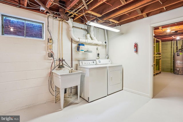 18312 Metz Dr, Germantown, MD 20874 - clothes washing area featuring water heater, washing machine and clothes dryer, and concrete block wall