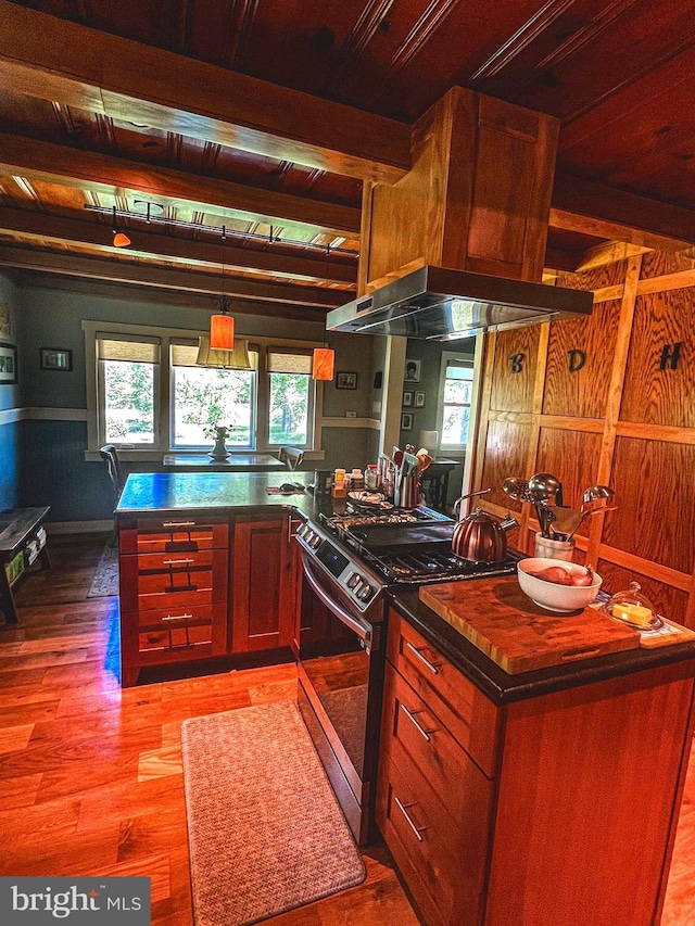 14308 Bristow Rd, Manassas, VA 20112 - kitchen featuring stainless steel range with gas cooktop, dark countertops, light wood-type flooring, beam ceiling, and a peninsula