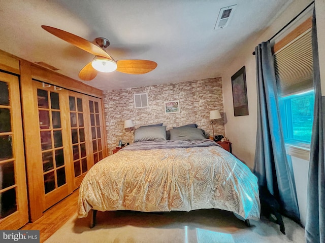 14308 Bristow Rd, Manassas, VA 20112 - bedroom featuring wood finished floors, ceiling fan, and french doors