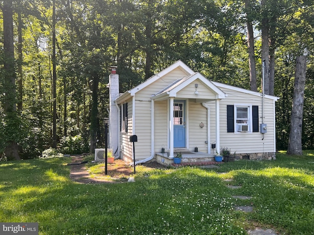 14308 Bristow Rd, Manassas, VA 20112 - view of front of home with a chimney, a front lawn, and cooling unit