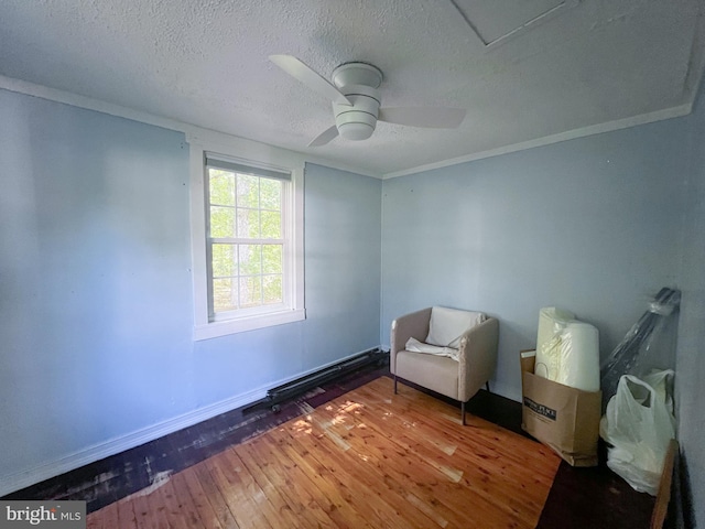 14308 Bristow Rd, Manassas, VA 20112 - living area featuring wood-type flooring, a textured ceiling, baseboards, ceiling fan, and ornamental molding