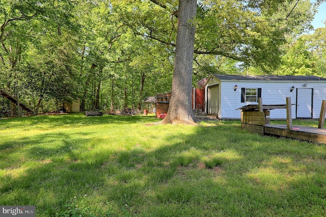 14308 Bristow Rd, Manassas, VA 20112 - view of green lawn featuring an outbuilding and a wooden deck
