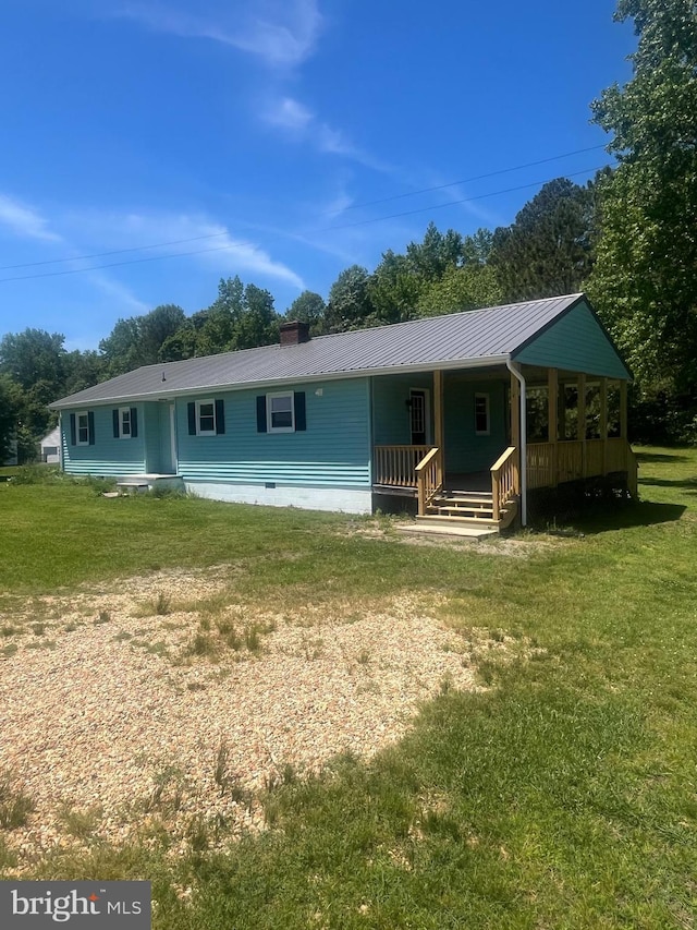 1807 Calvary Church Rd, Warsaw, VA 22572 - view of front of home featuring a porch, a front lawn, and metal roof