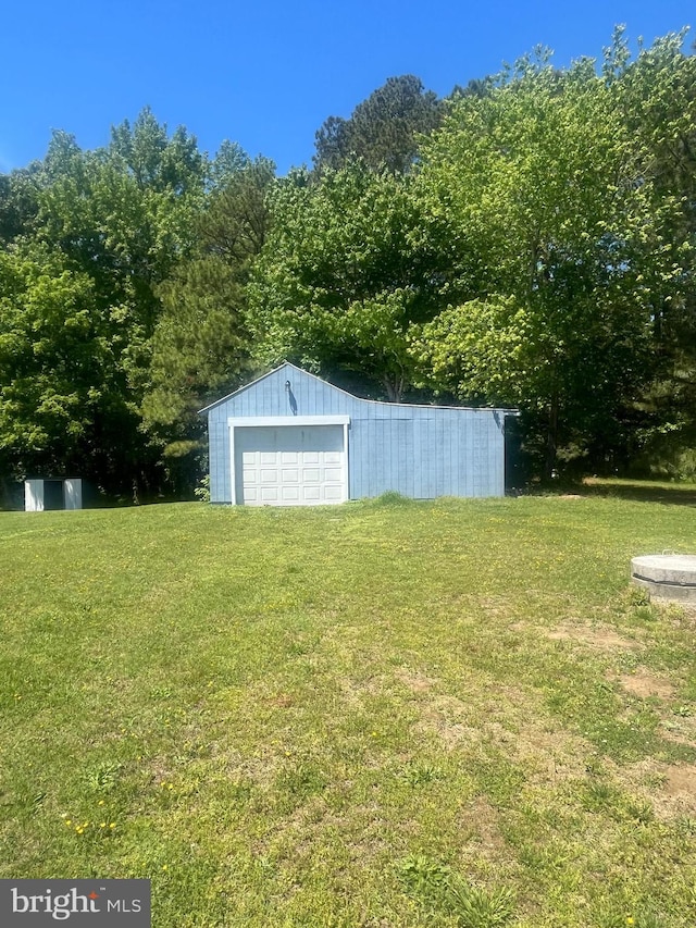1807 Calvary Church Rd, Warsaw, VA 22572 - view of green lawn featuring an outbuilding and a garage