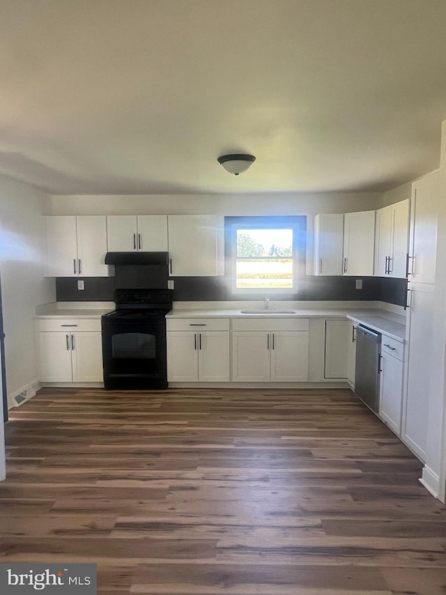 1807 Calvary Church Rd, Warsaw, VA 22572 - kitchen with black range with electric stovetop, under cabinet range hood, dishwasher, a sink, and white cabinets