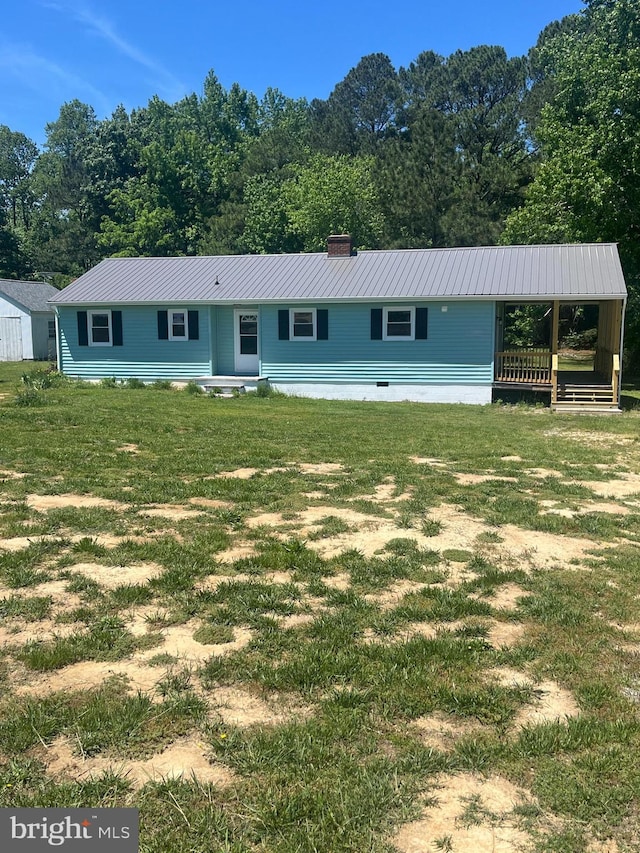 1807 Calvary Church Rd, Warsaw, VA 22572 - view of front of home featuring metal roof, a chimney, and a front yard
