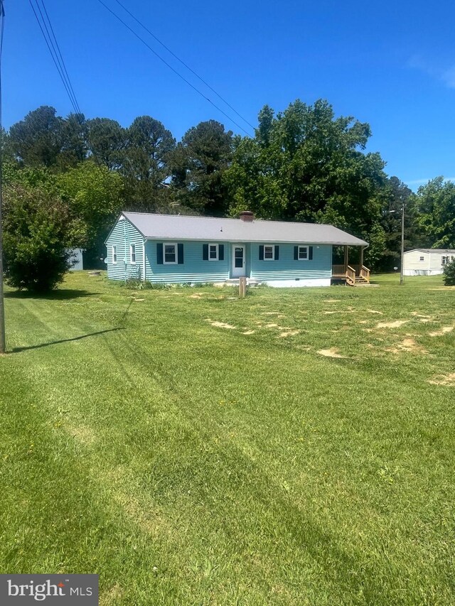 1807 Calvary Church Rd, Warsaw, VA 22572 - view of front facade featuring a front yard and view of wooded area