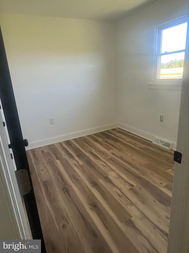 1807 Calvary Church Rd, Warsaw, VA 22572 - unfurnished room with wood finished floors and baseboards