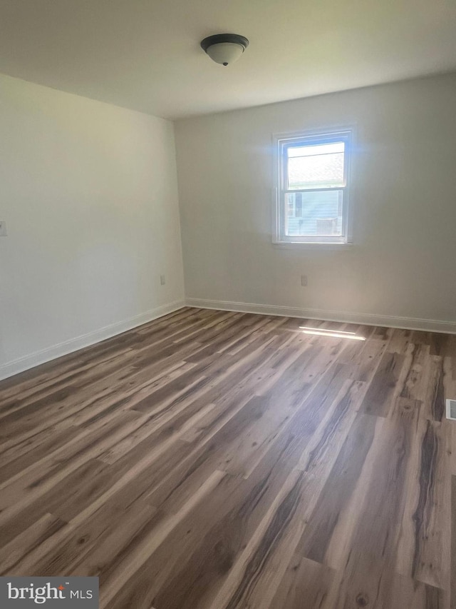 1807 Calvary Church Rd, Warsaw, VA 22572 - spare room with wood finished floors and baseboards