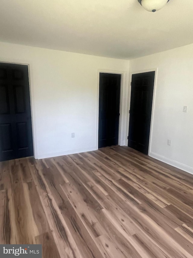 1807 Calvary Church Rd, Warsaw, VA 22572 - unfurnished bedroom featuring wood finished floors and baseboards