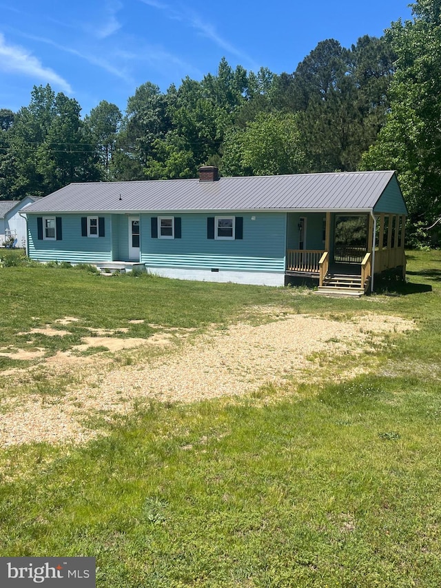 1807 Calvary Church Rd, Warsaw, VA 22572 - view of front of property featuring a chimney, a front lawn, and metal roof