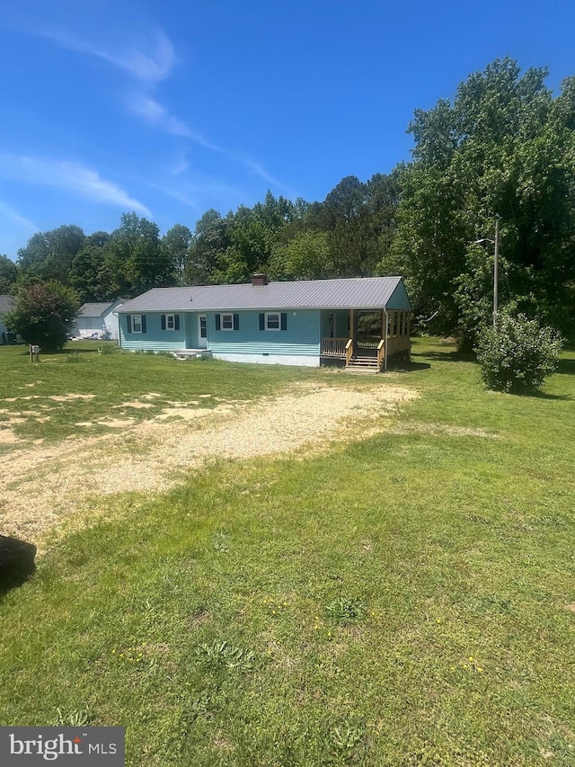 1807 Calvary Church Rd, Warsaw, VA 22572 - rear view of house featuring driveway, a lawn, and metal roof