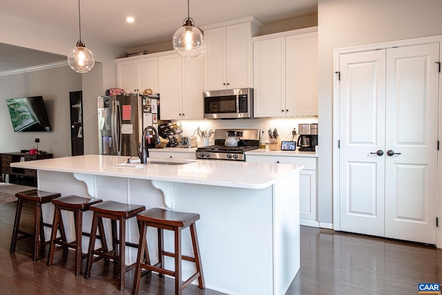 1509 Delphi Ln, Charlottesville, VA 22911 - kitchen featuring stainless steel appliances, a sink, a kitchen island with sink, backsplash, and white cabinets