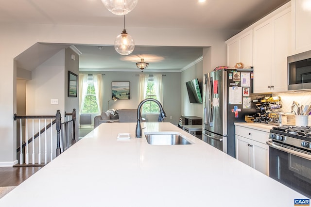 1509 Delphi Ln, Charlottesville, VA 22911 - kitchen with a sink, stainless steel appliances, crown molding, light countertops, and white cabinets