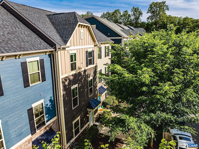 1509 Delphi Ln, Charlottesville, VA 22911 - view of side of home with board and batten siding and a shingled roof