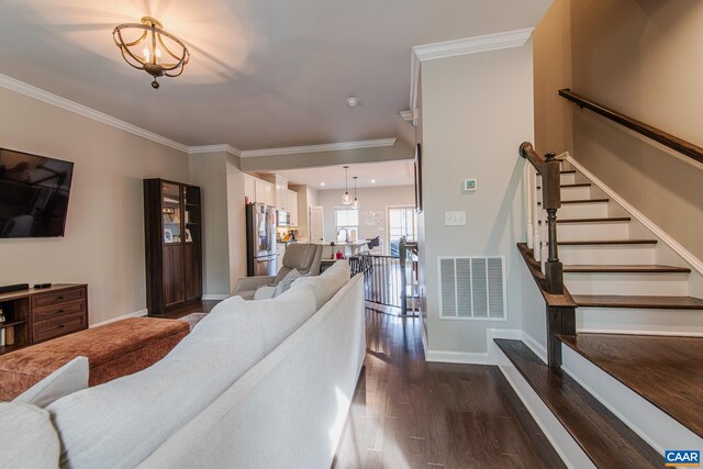 1509 Delphi Ln, Charlottesville, VA 22911 - living room with dark wood-style flooring, baseboards, ornamental molding, stairway, and a chandelier