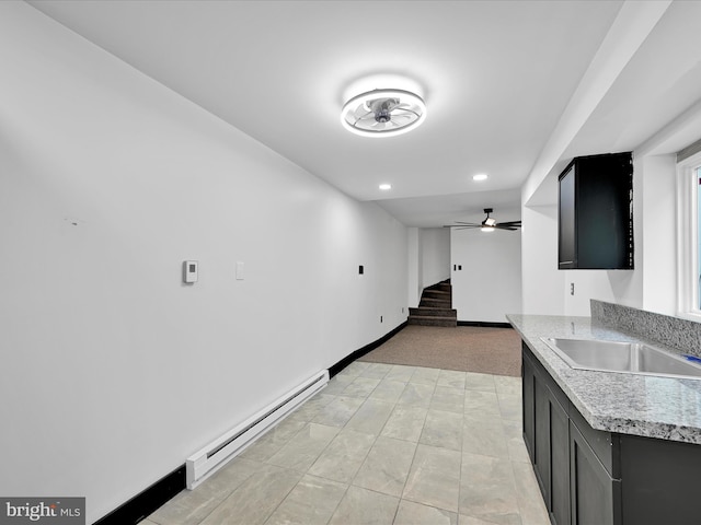 1420 W Walnut St, Ashland, PA 17921 - kitchen with baseboard heating, a sink, dark cabinetry, light colored carpet, and recessed lighting