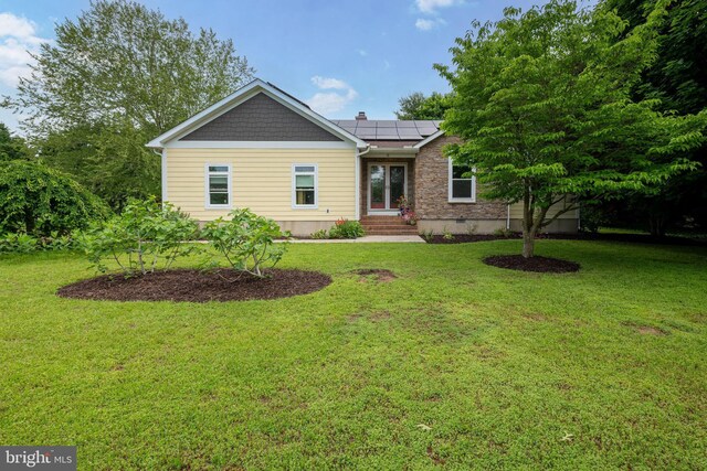 13 Deerfield Ln, Rehoboth Beach, DE 19971 - single story home featuring entry steps, solar panels, and a front yard
